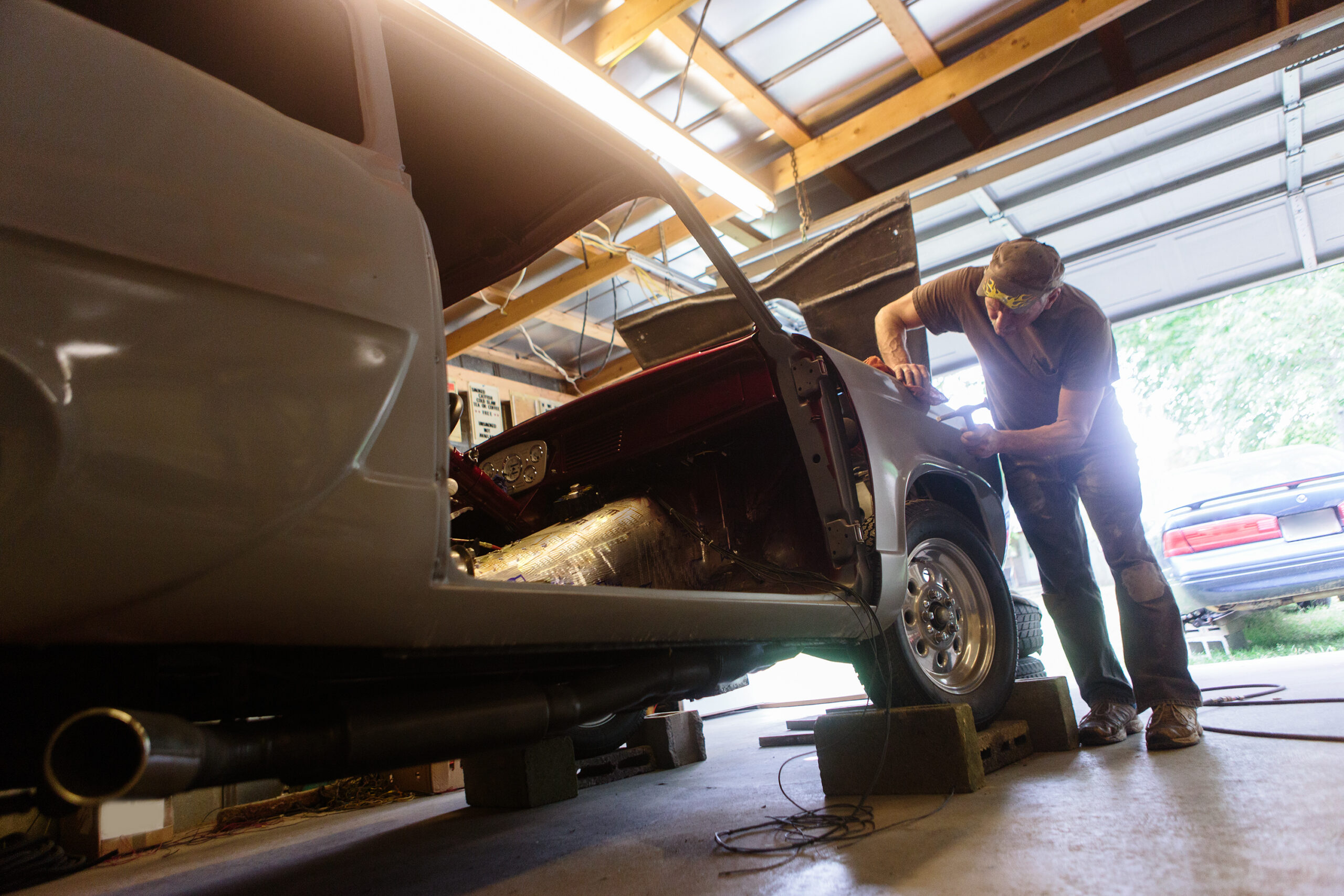 Man working on a car in a garage